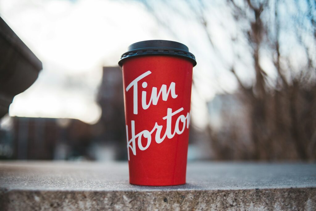 red and white plastic cup on gray concrete floor